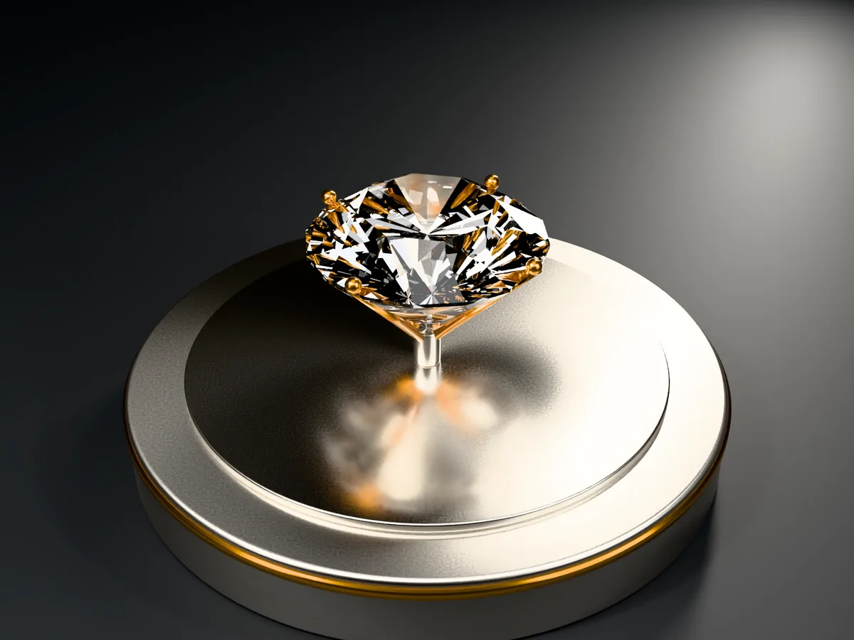 A brilliant-cut gemstone held in an amber four-prong setting on a turned metal stage